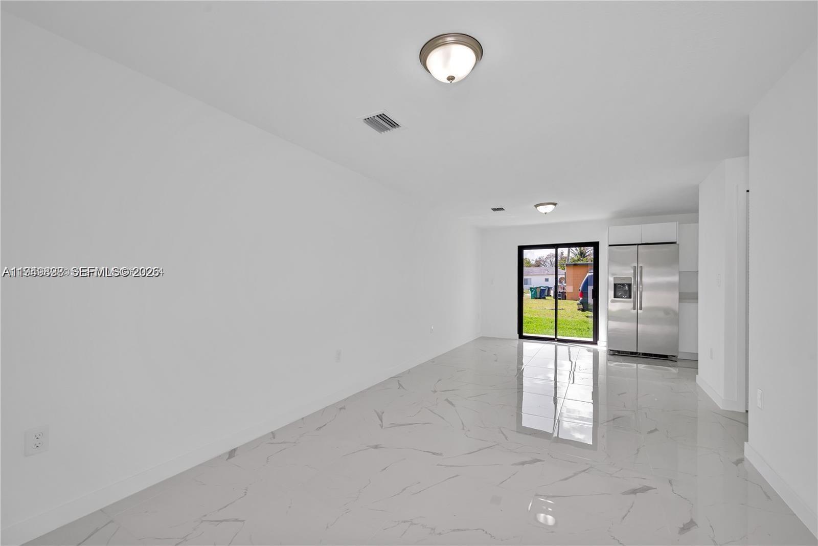 673 Northwest 14th Street, Unit 1 Florida City, FL 33034 - Photo 4 of 21 a view of an empty room