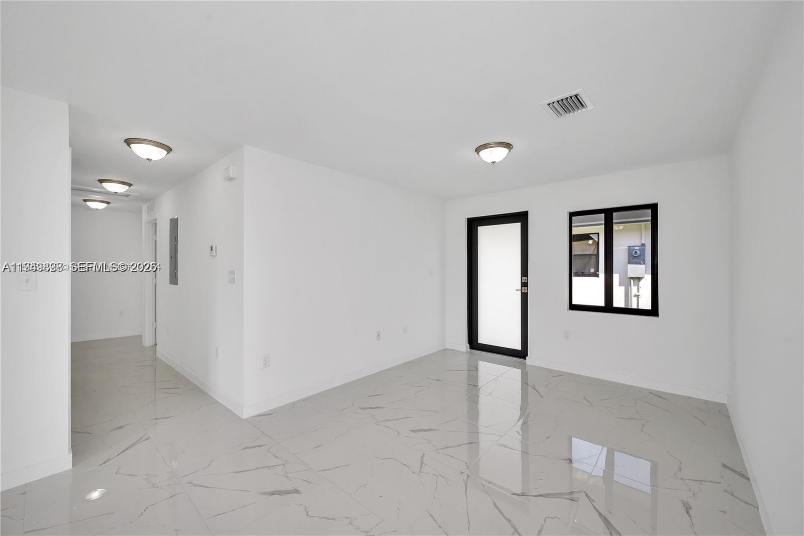 673 Northwest 14th Street, Unit 1 Florida City, FL 33034 - Photo 5 of 21 a view of livingroom with hardwood