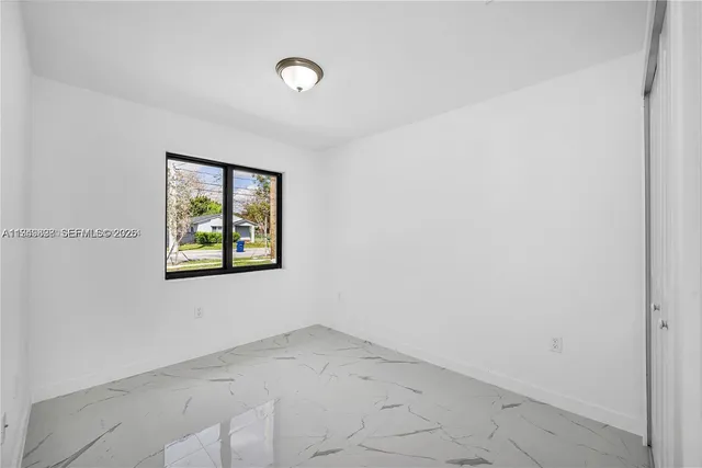 a view of a livingroom with wooden shelves