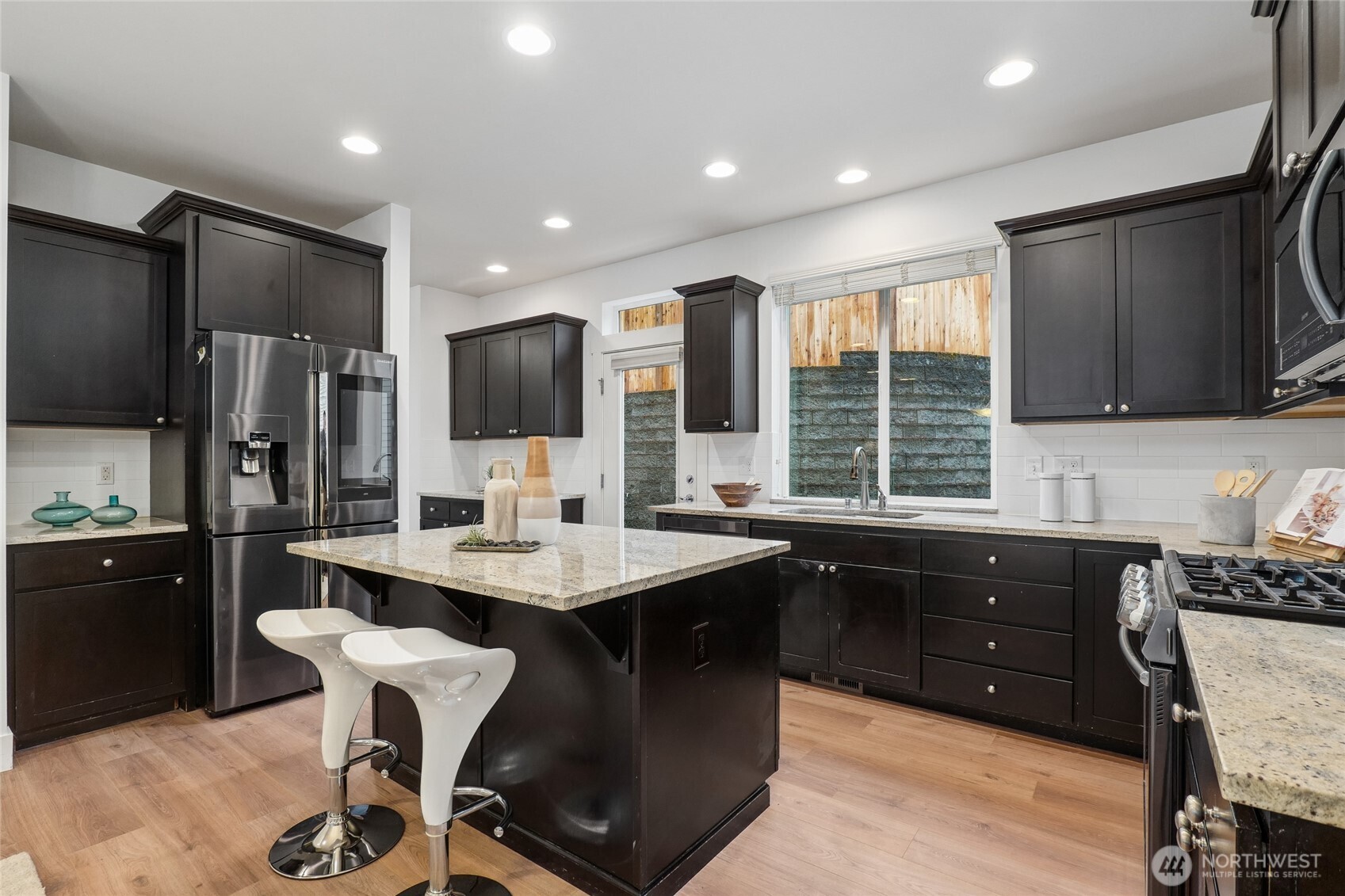 12823 65th Place West Edmonds, WA 98026 - Photo 12 of 32 a kitchen with granite countertop a sink appliances cabinets and furniture