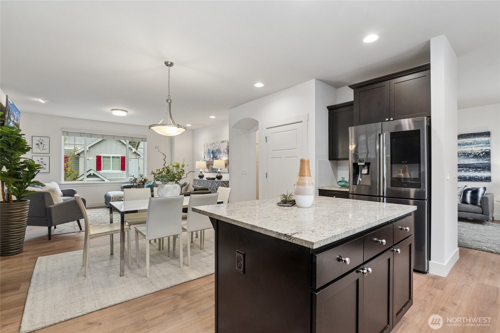 12823 65th Place West Edmonds, WA 98026 - Photo 13 of 32 a open kitchen with a table and chairs in it