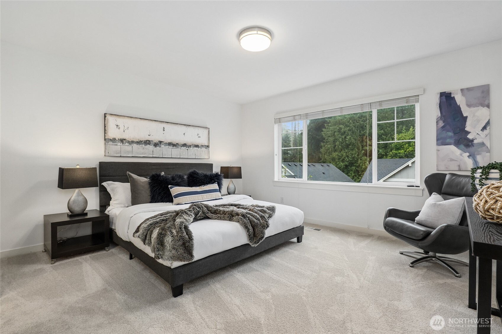 12823 65th Place West Edmonds, WA 98026 - Photo 21 of 32 a bedroom with a bed and a large window