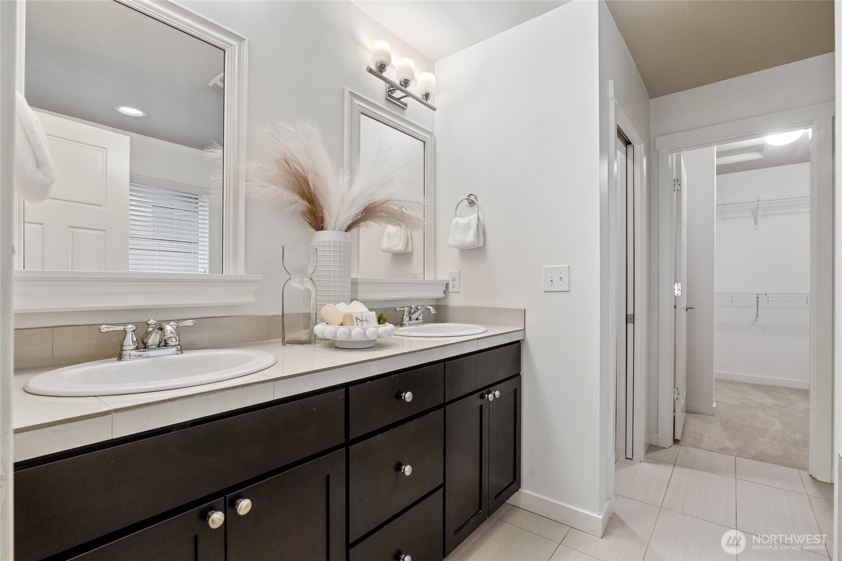 12823 65th Place West Edmonds, WA 98026 - Photo 22 of 32 a bathroom with a double vanity sink mirror and shower