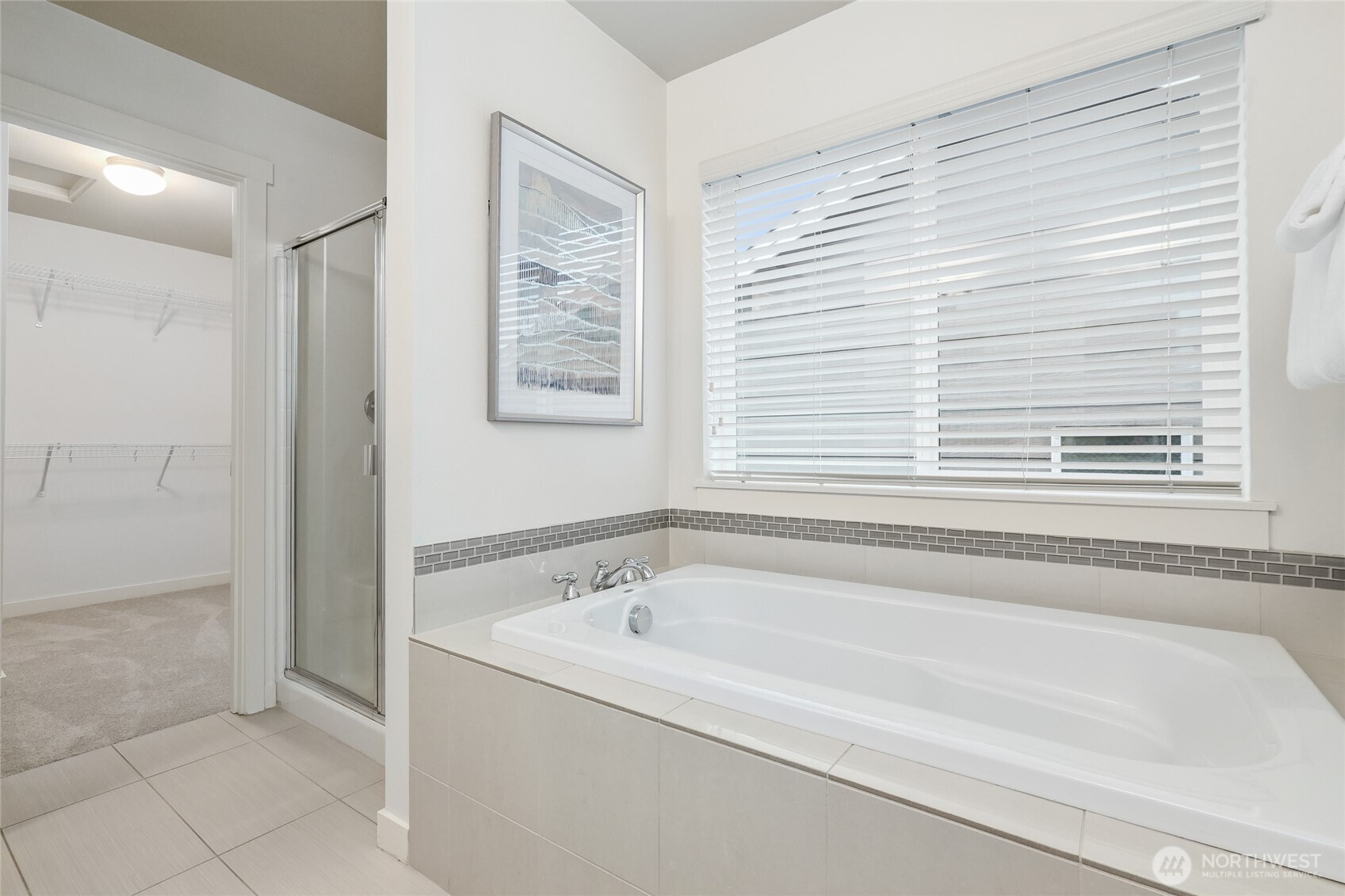 12823 65th Place West Edmonds, WA 98026 - Photo 23 of 32 a bathroom with bathtub and window