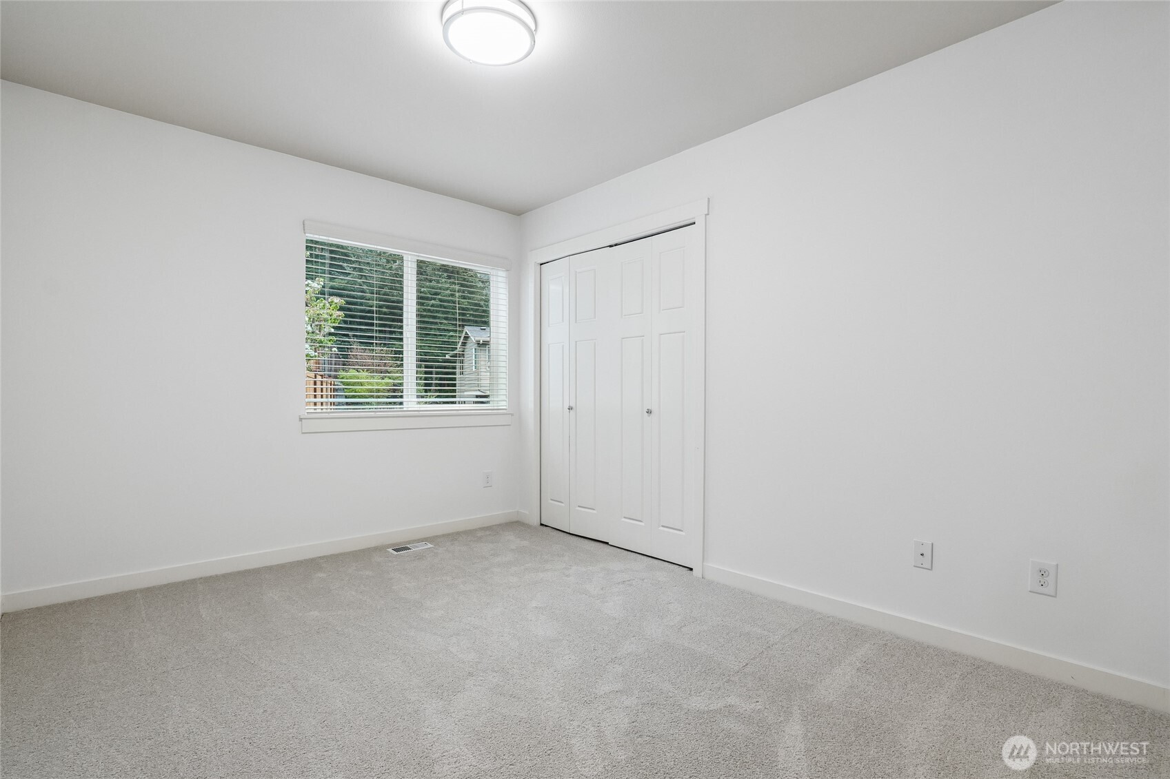 12823 65th Place West Edmonds, WA 98026 - Photo 25 of 32 an empty room with windows
