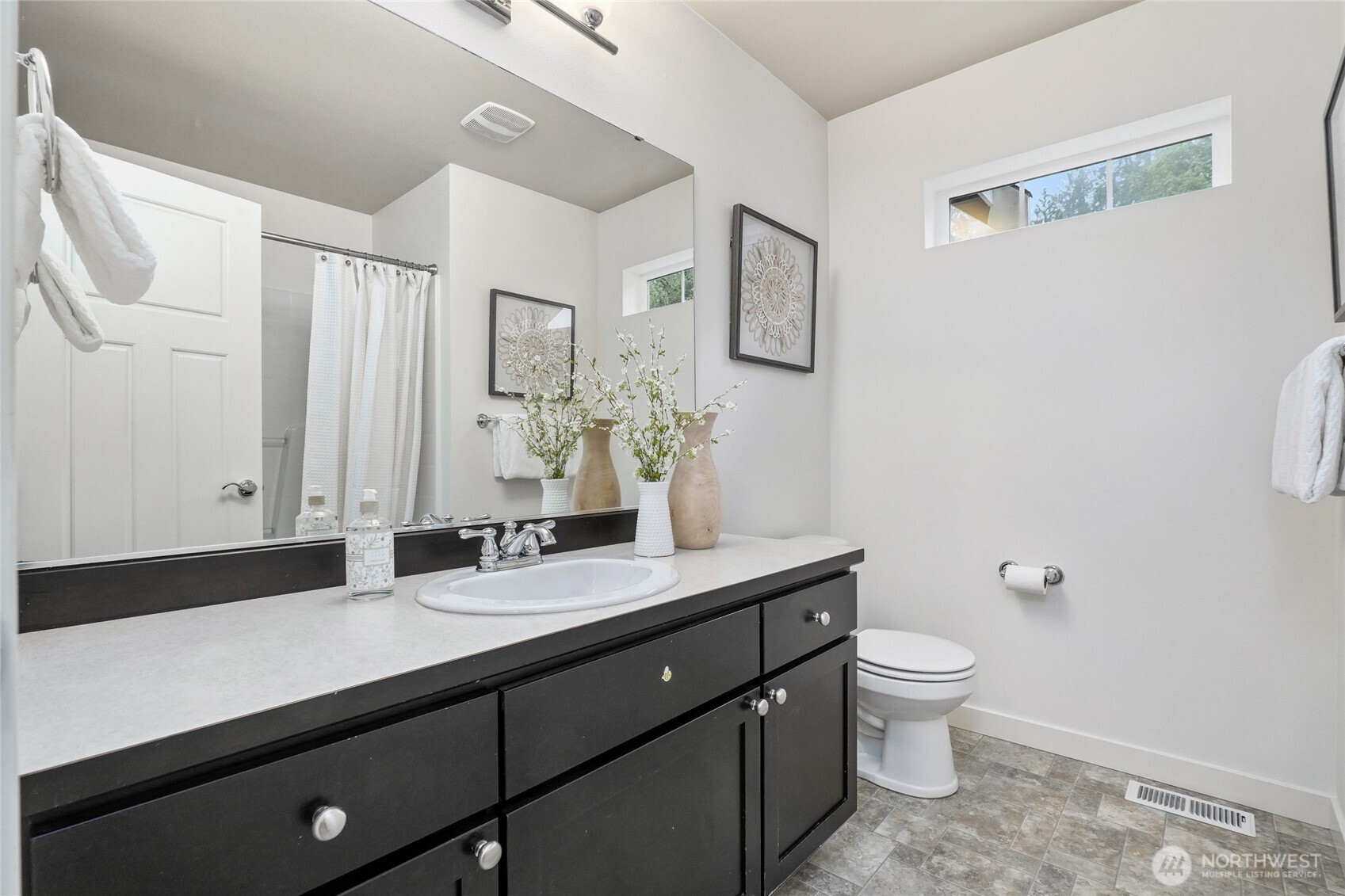 12823 65th Place West Edmonds, WA 98026 - Photo 26 of 32 a bathroom with a granite countertop sink a toilet and mirror