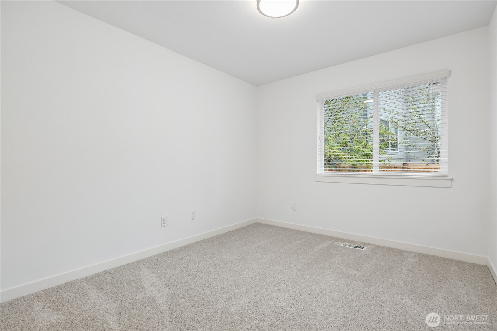 12823 65th Place West Edmonds, WA 98026 - Photo 27 of 32 an empty room with a window