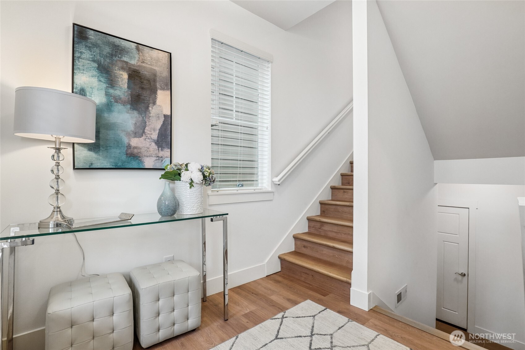 12823 65th Place West Edmonds, WA 98026 - Photo 5 of 32 a view of a hallway with wooden floor and staircase