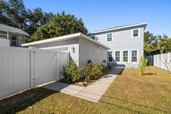 front view of a house with a yard
