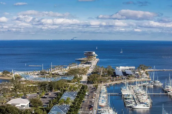 an aerial view of city and lake