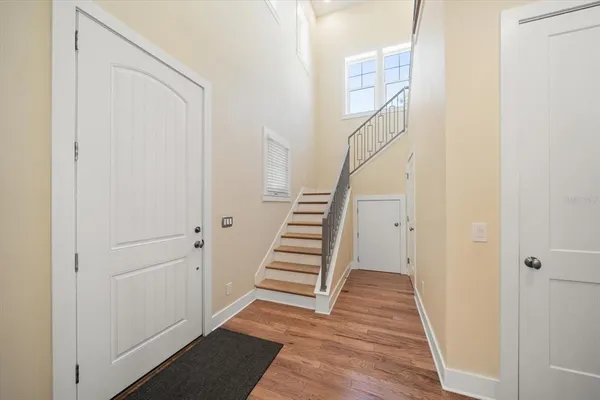 a view of entryway with wooden floor