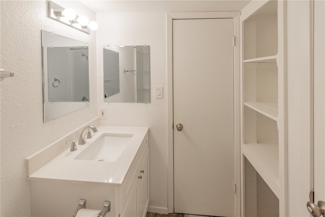 2500 Burleson Road, Unit 614 Austin, TX 78741 - Photo 11 of 20 a bathroom with a sink and mirror