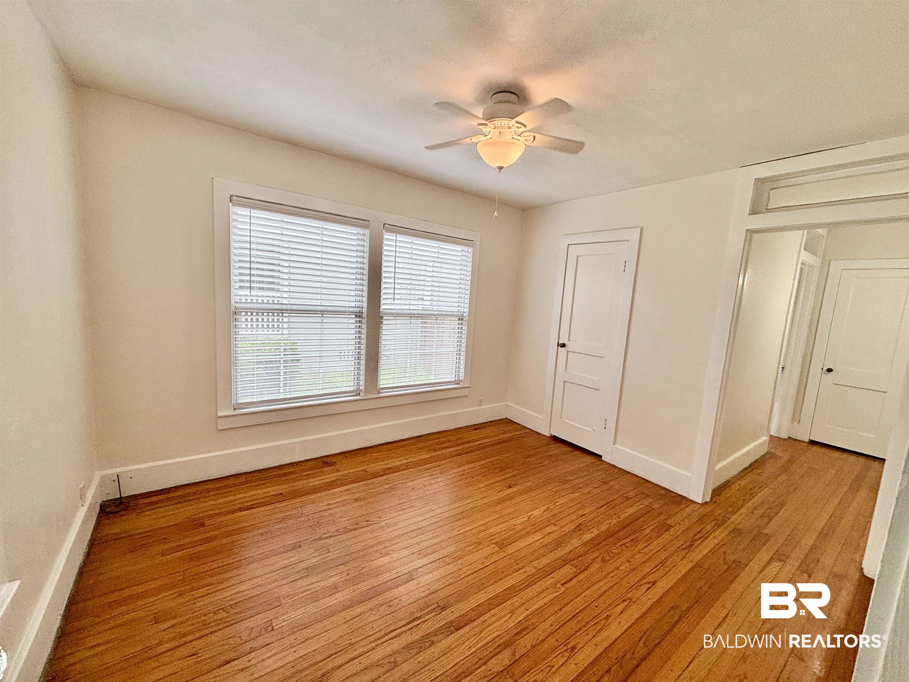 114 Crenshaw Street Mobile, AL 36606 - Photo 30 of 49 Unfurnished bedroom with light wood-type flooring, baseboards, and a ceiling fan
