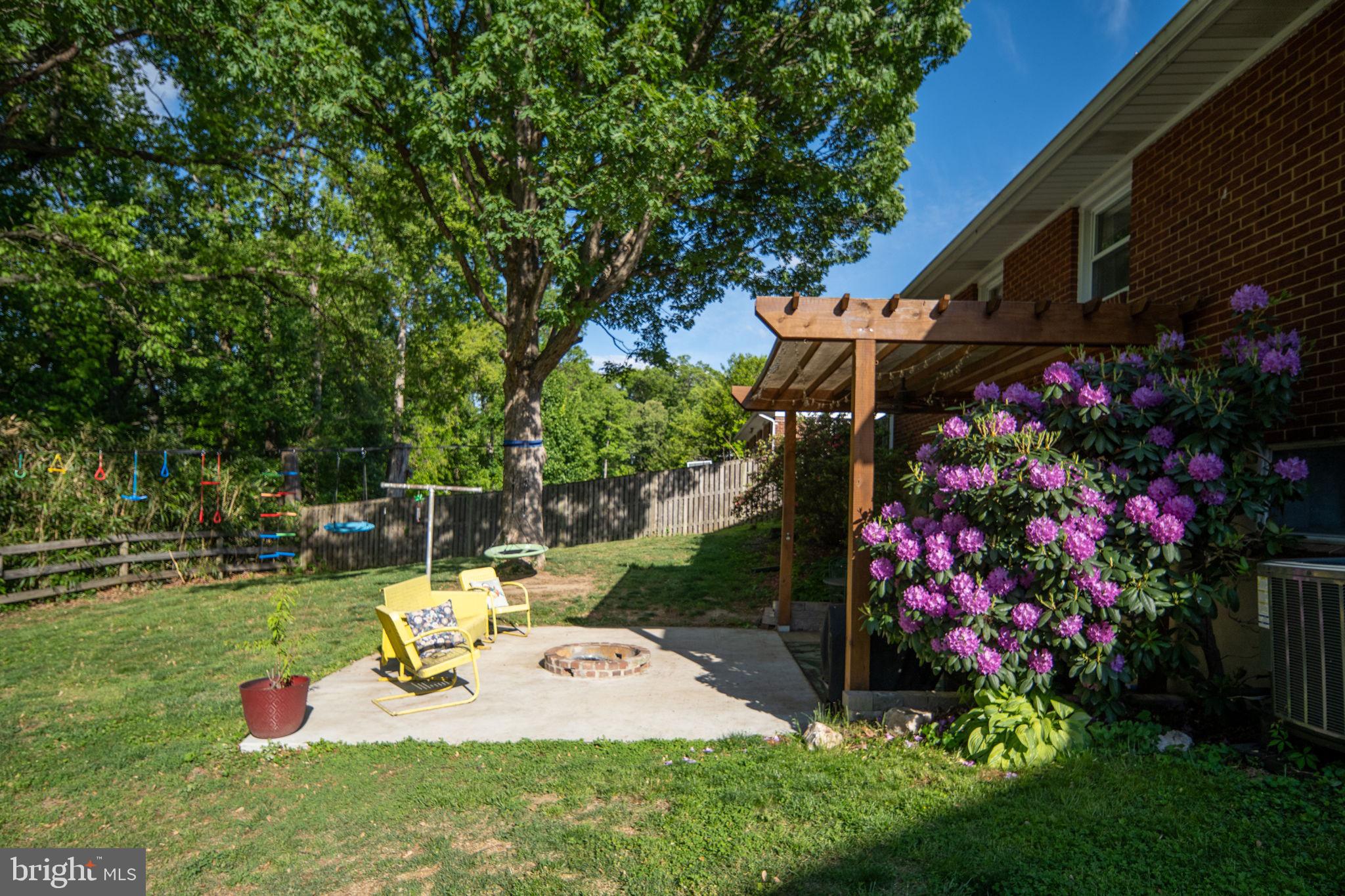 6714 Ruskin Street Springfield, VA 22150 - Photo 50 of 63 a view of a garden with flowers and trees