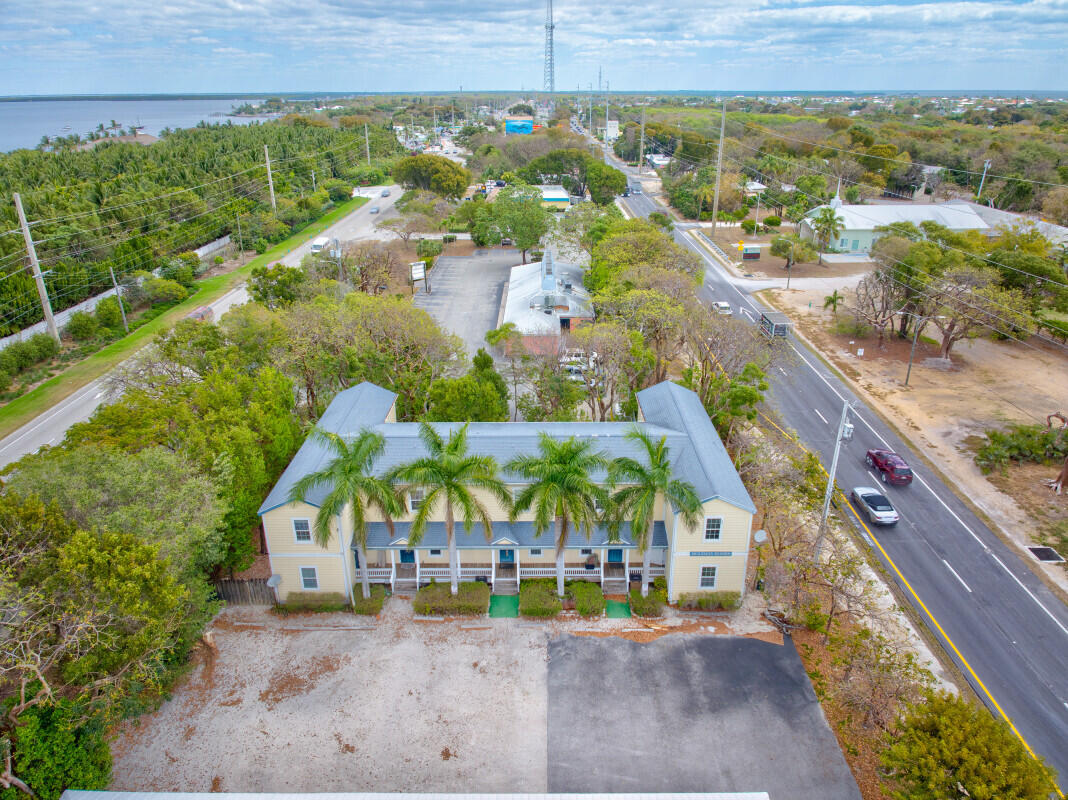 98980 Overseas Highway Key Largo, FL 33037 - Photo 1 of 12 an aerial view of a house with a yard