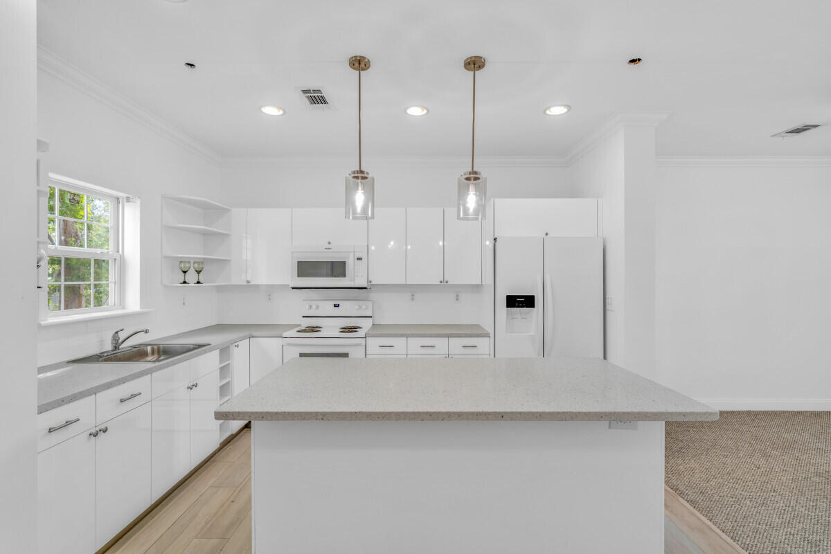 98980 Overseas Highway Key Largo, FL 33037 - Photo 7 of 12 a large kitchen with cabinets