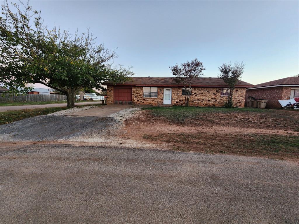 9 Palmer Circle Merkel, TX 79536 - Photo 1 of 1 a view of a house with a yard and garage
