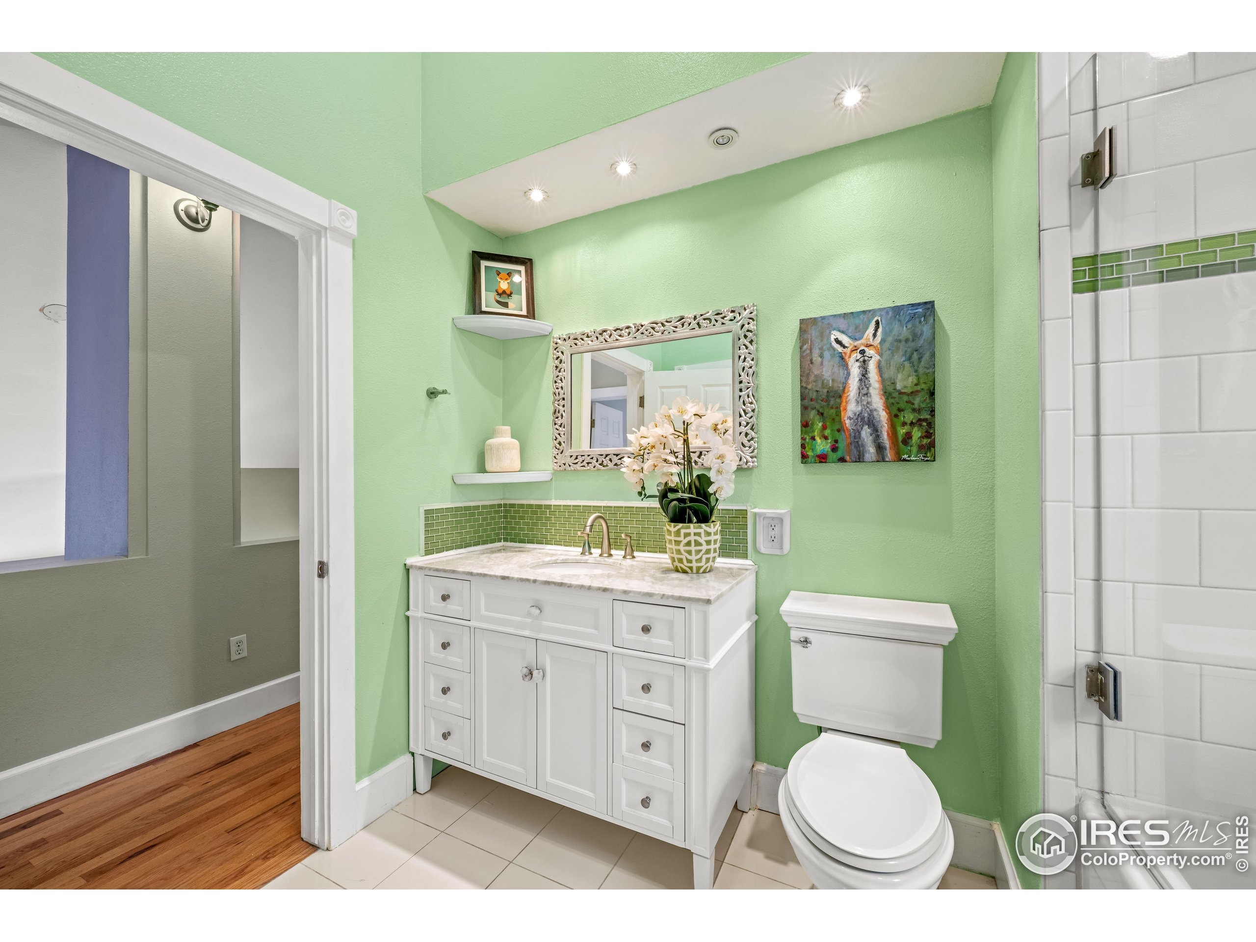 301 Valley Lane Boulder, CO 80302 - Photo 14 of 46 a bathroom with a toilet a sink and a mirror