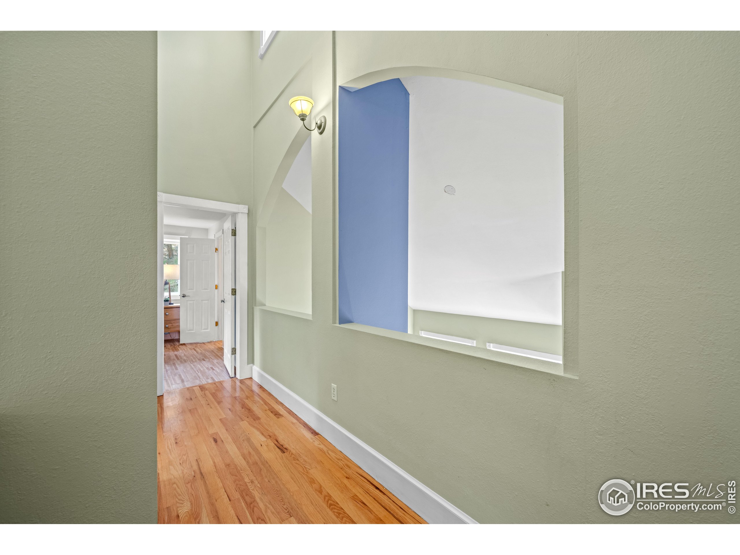 301 Valley Lane Boulder, CO 80302 - Photo 19 of 46 a view of an empty room with wooden floor