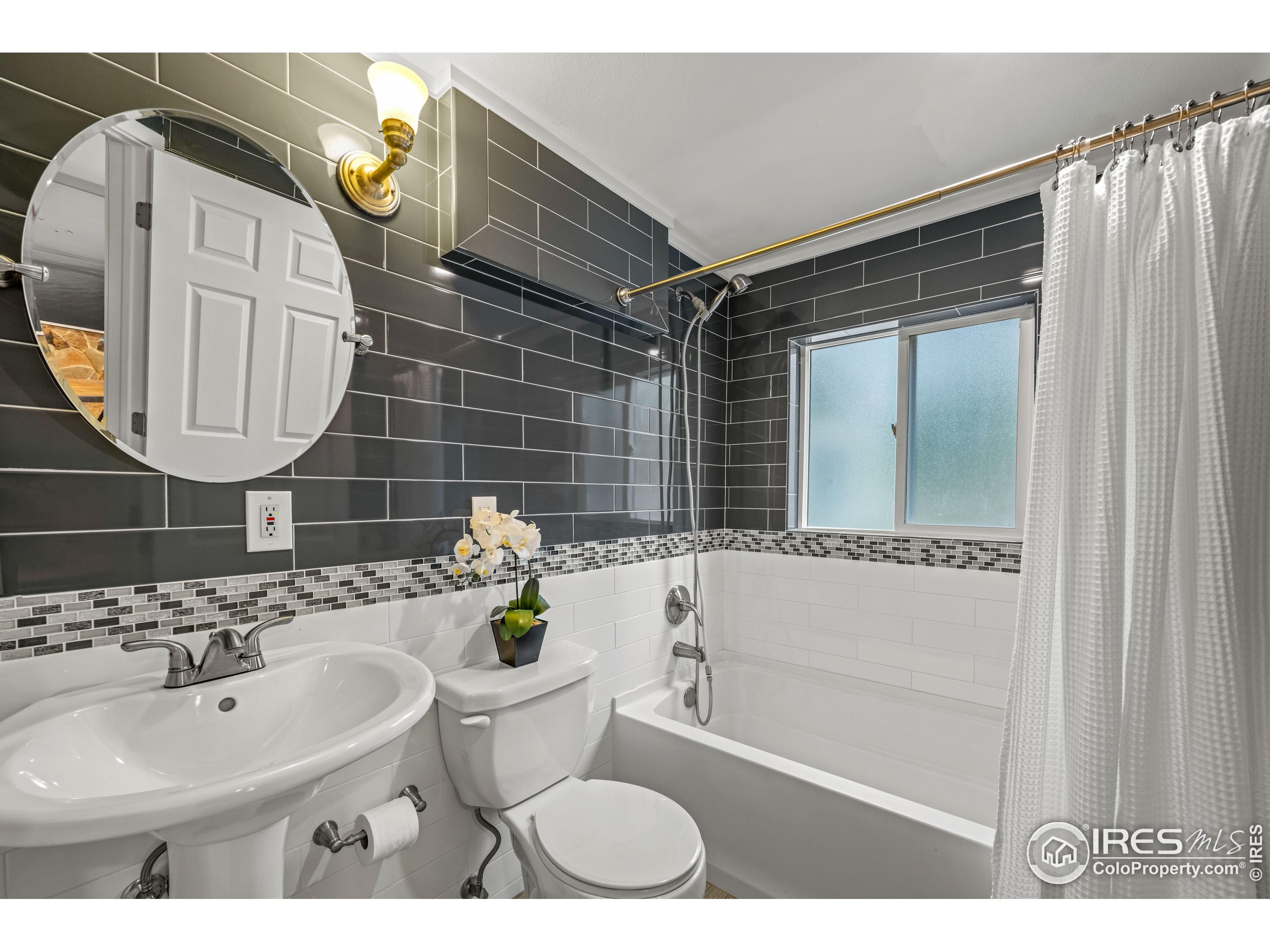 301 Valley Lane Boulder, CO 80302 - Photo 23 of 46 a bathroom with a sink toilet and shower