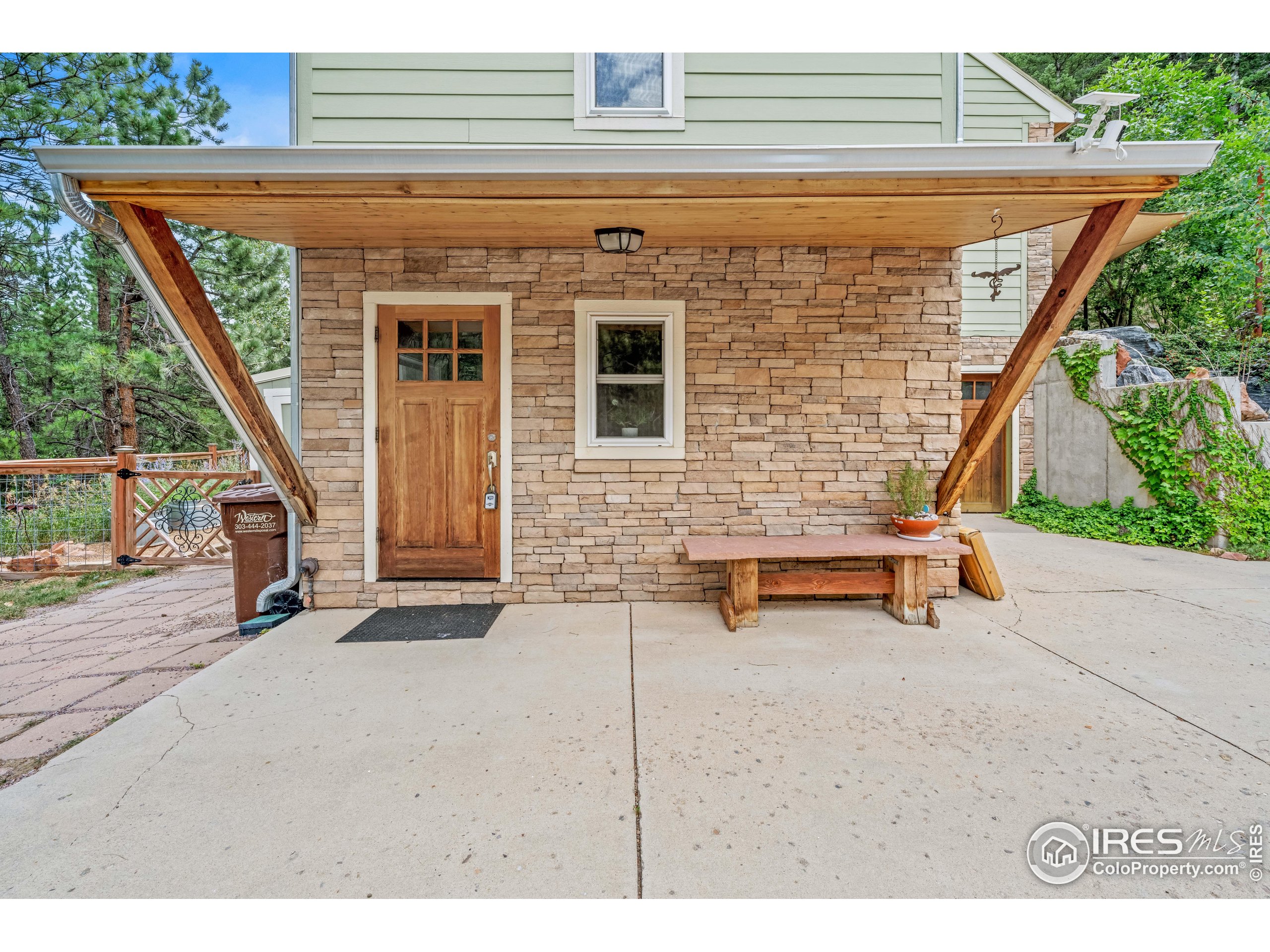 301 Valley Lane Boulder, CO 80302 - Photo 28 of 46 a backyard of a house with barbeque oven table and chairs