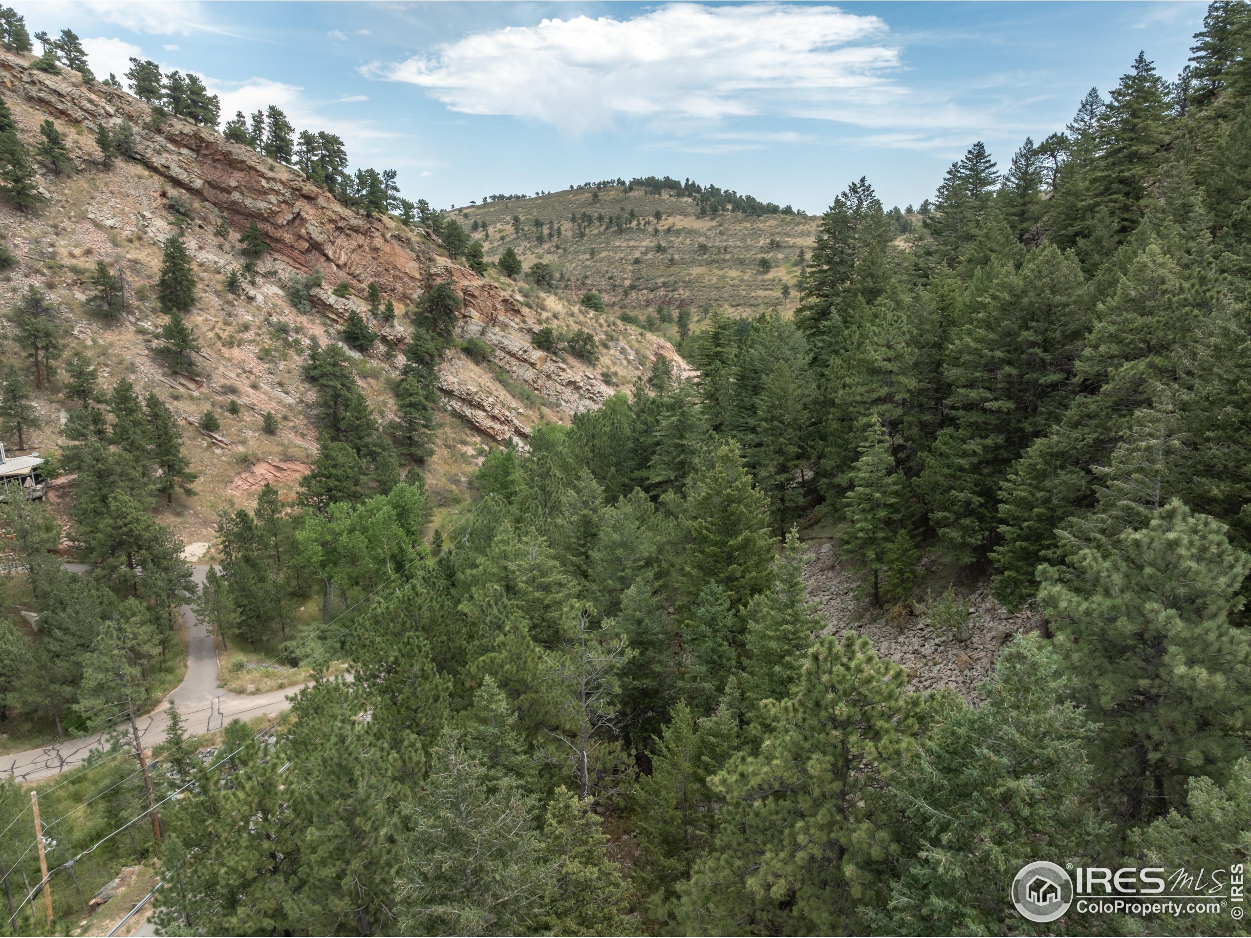 301 Valley Lane Boulder, CO 80302 - Photo 44 of 46 a view of a city with lush green forest