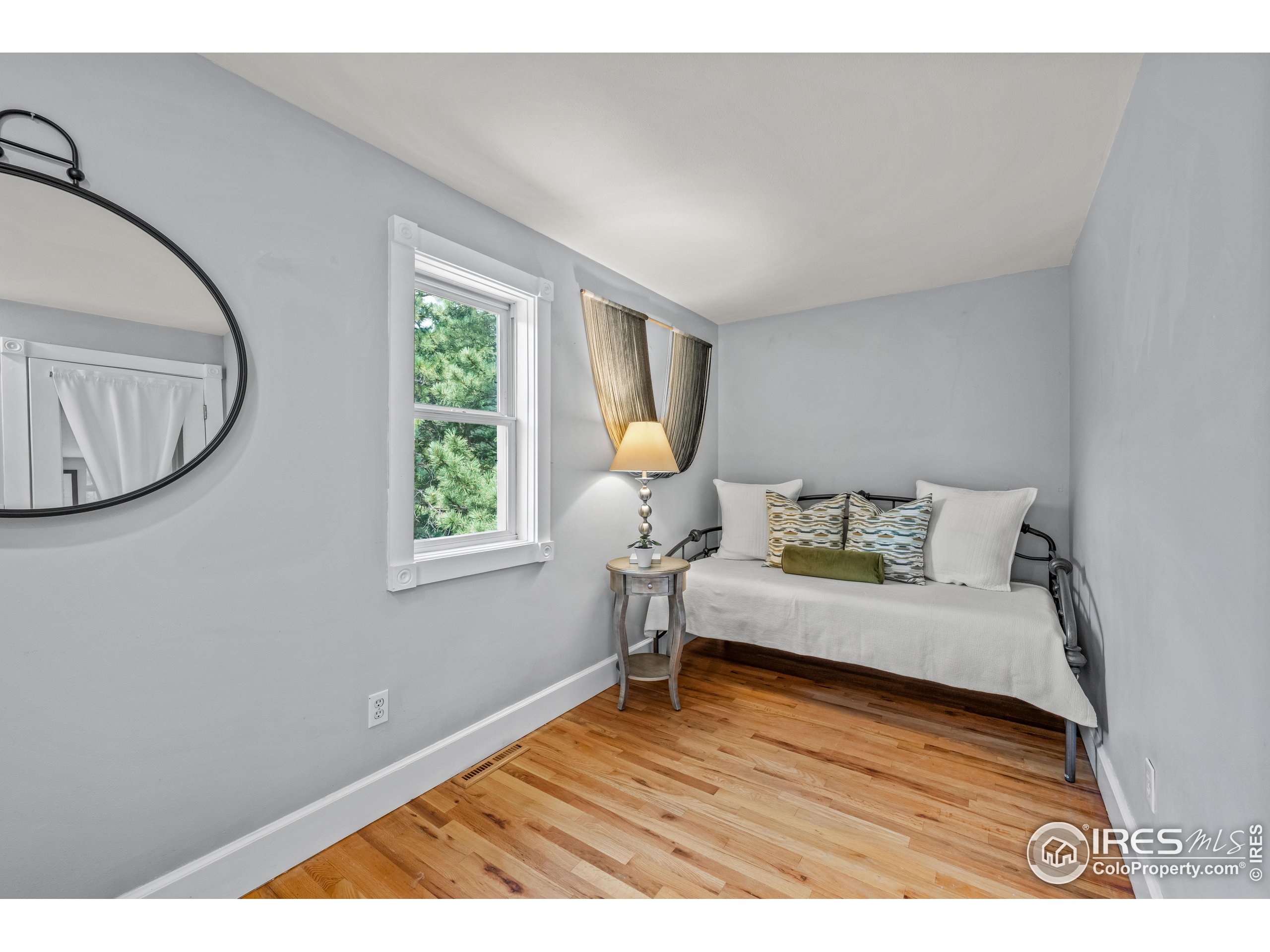 301 Valley Lane Boulder, CO 80302 - Photo 10 of 46 a bedroom with a bed and a large window