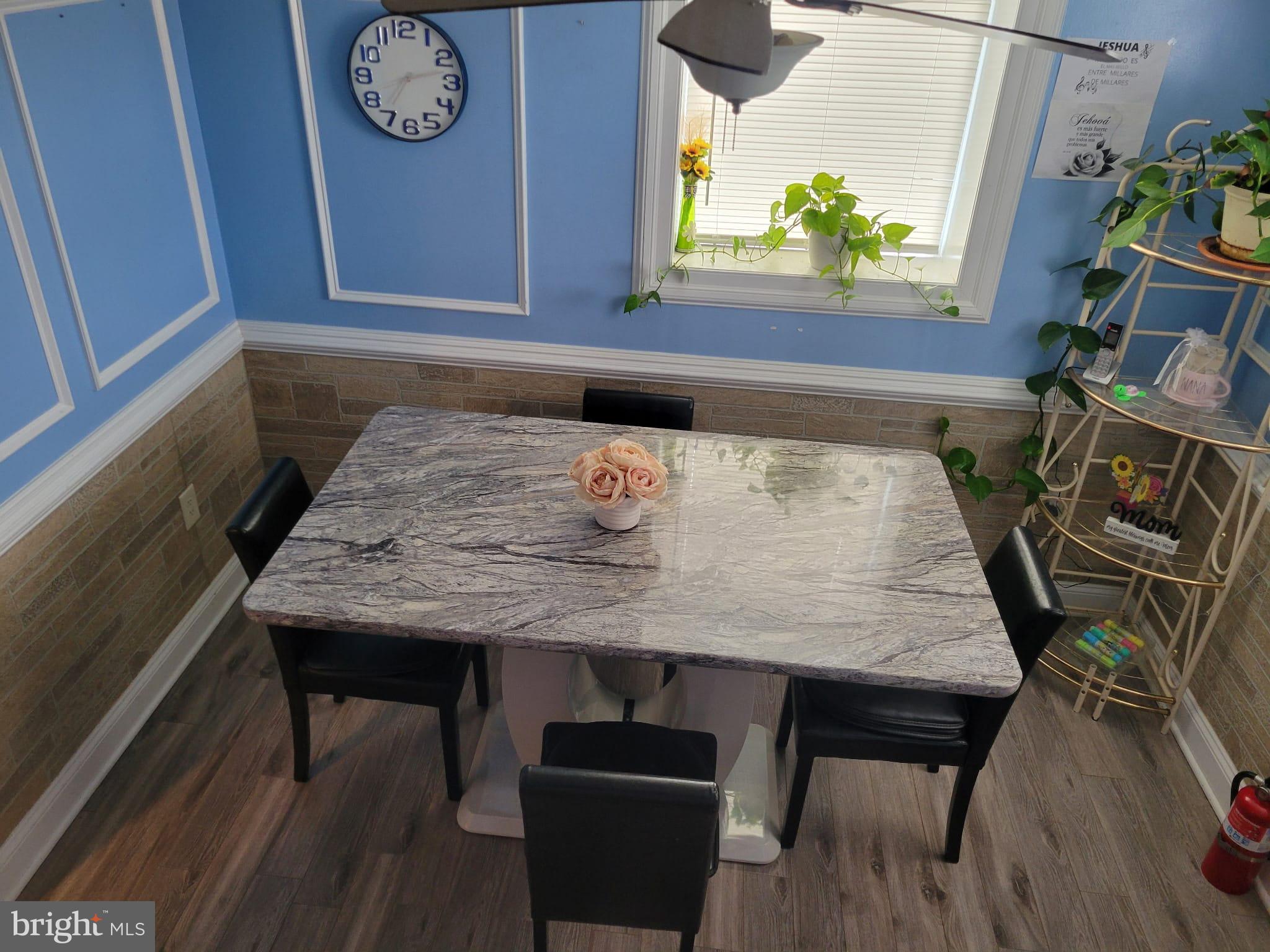 10019 Lomond Drive Manassas, VA 20109 - Photo 11 of 31 a view of a dining room with furniture and wooden floor