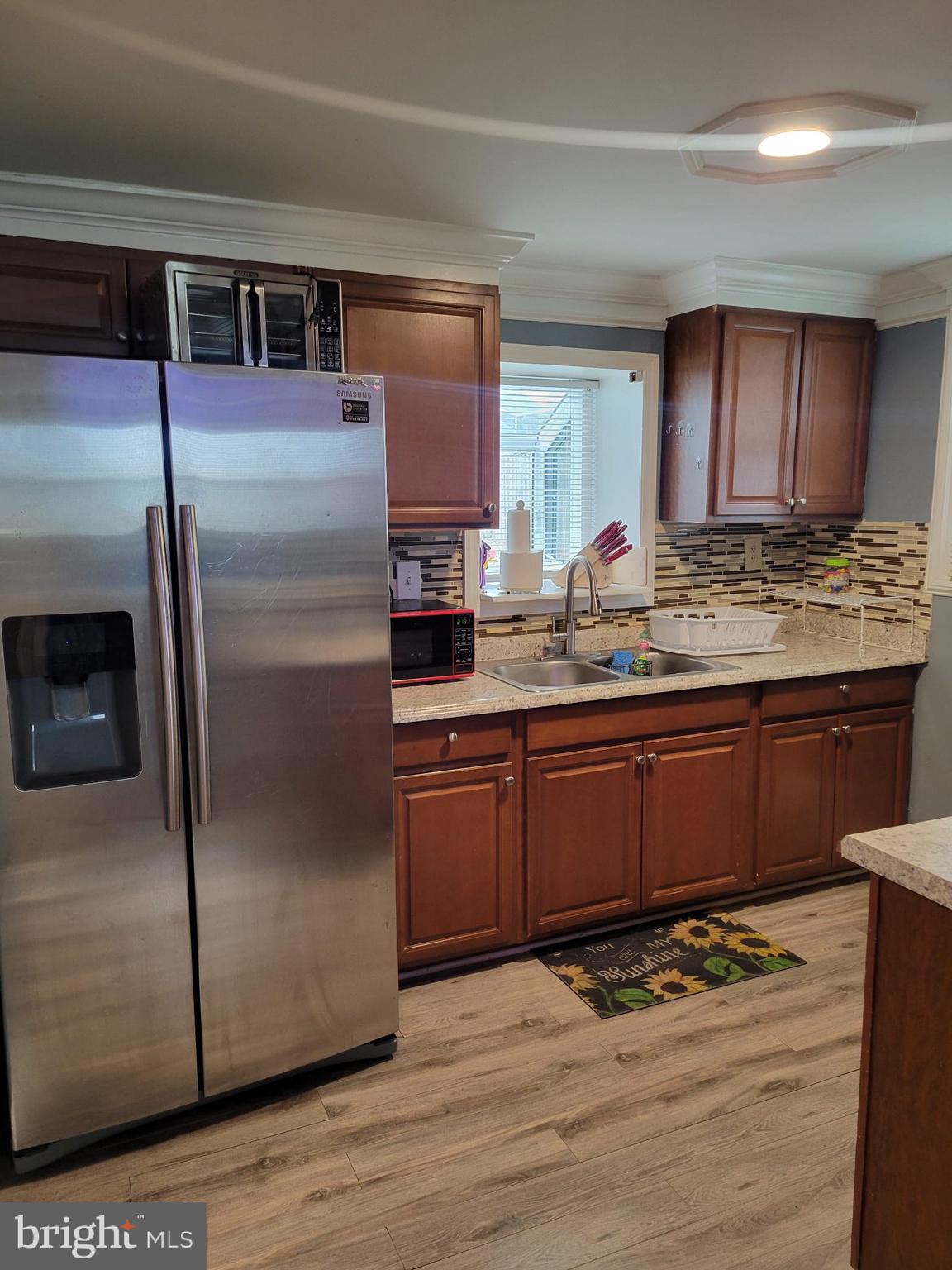 10019 Lomond Drive Manassas, VA 20109 - Photo 13 of 31 a kitchen with stainless steel appliances granite countertop a refrigerator and a stove