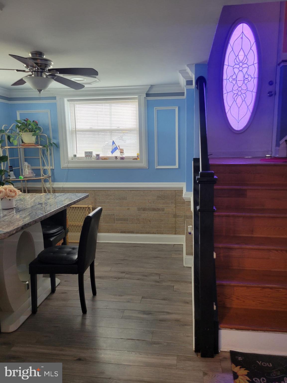 10019 Lomond Drive Manassas, VA 20109 - Photo 15 of 31 a view of a dining room with furniture and a chandelier