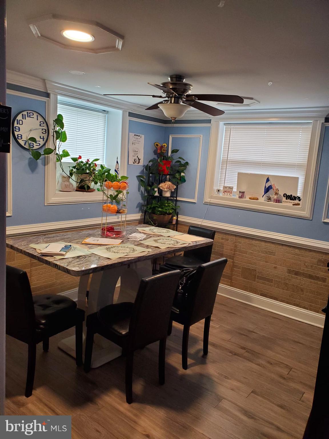 10019 Lomond Drive Manassas, VA 20109 - Photo 25 of 31 a dining room filled chandelier and wooden floor