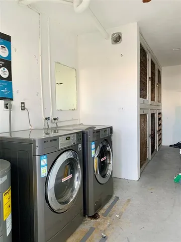 a utility room with closet dryer and washer