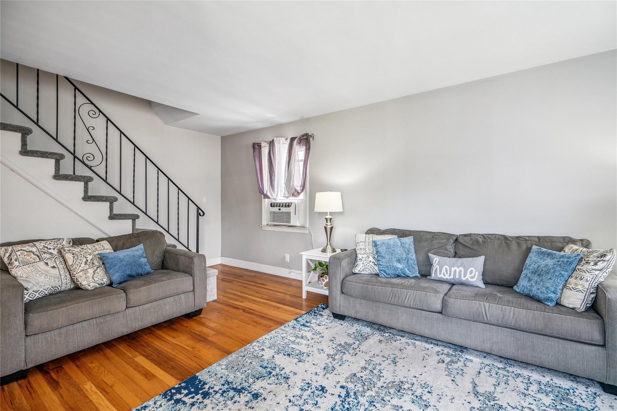 12 Westmoreland Road Merrick, NY 11566 - Photo 12 of 42 a living room with furniture and a couch