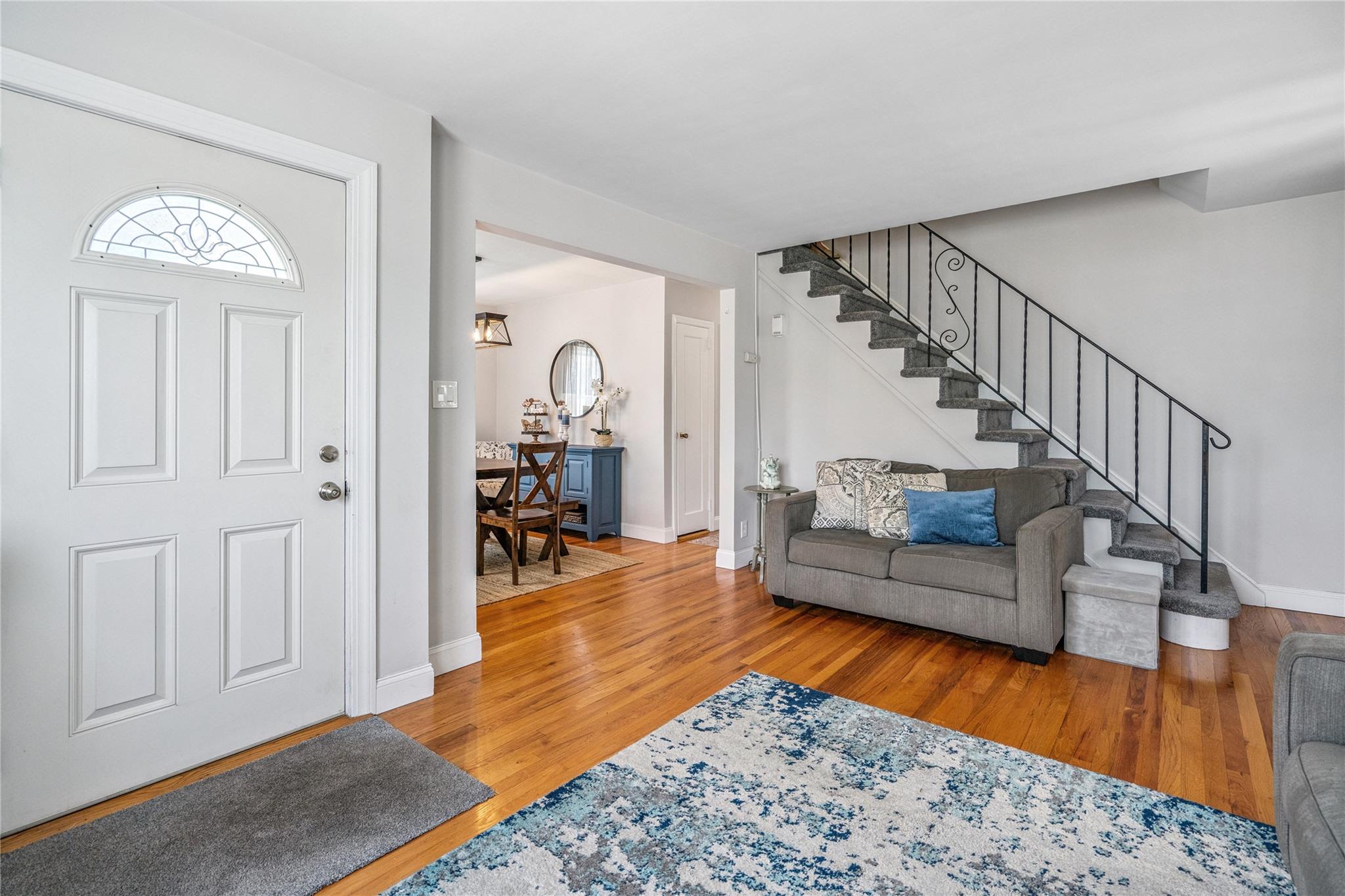 12 Westmoreland Road Merrick, NY 11566 - Photo 15 of 42 a living room with furniture and a wooden floor
