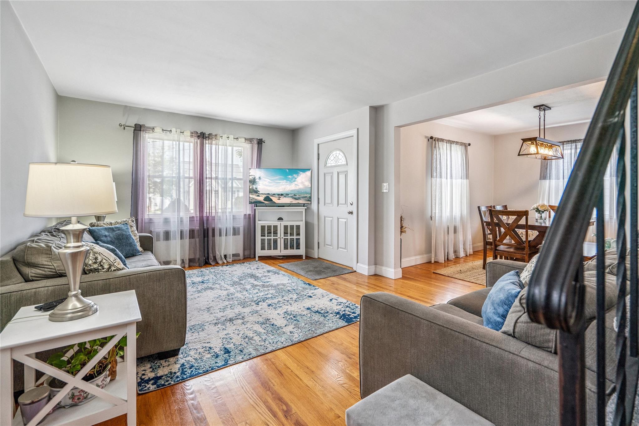 12 Westmoreland Road Merrick, NY 11566 - Photo 16 of 42 a living room with furniture and a wooden floor