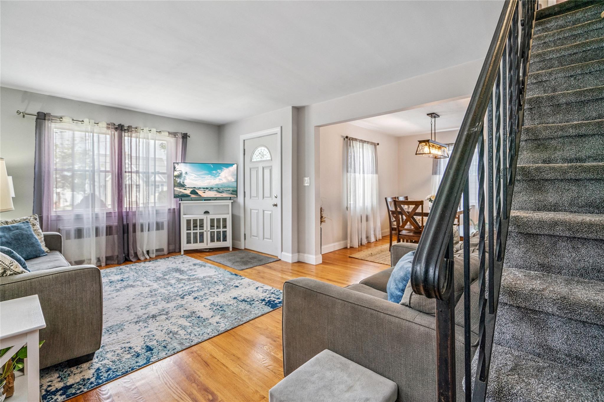12 Westmoreland Road Merrick, NY 11566 - Photo 17 of 42 a living room with furniture and a rug