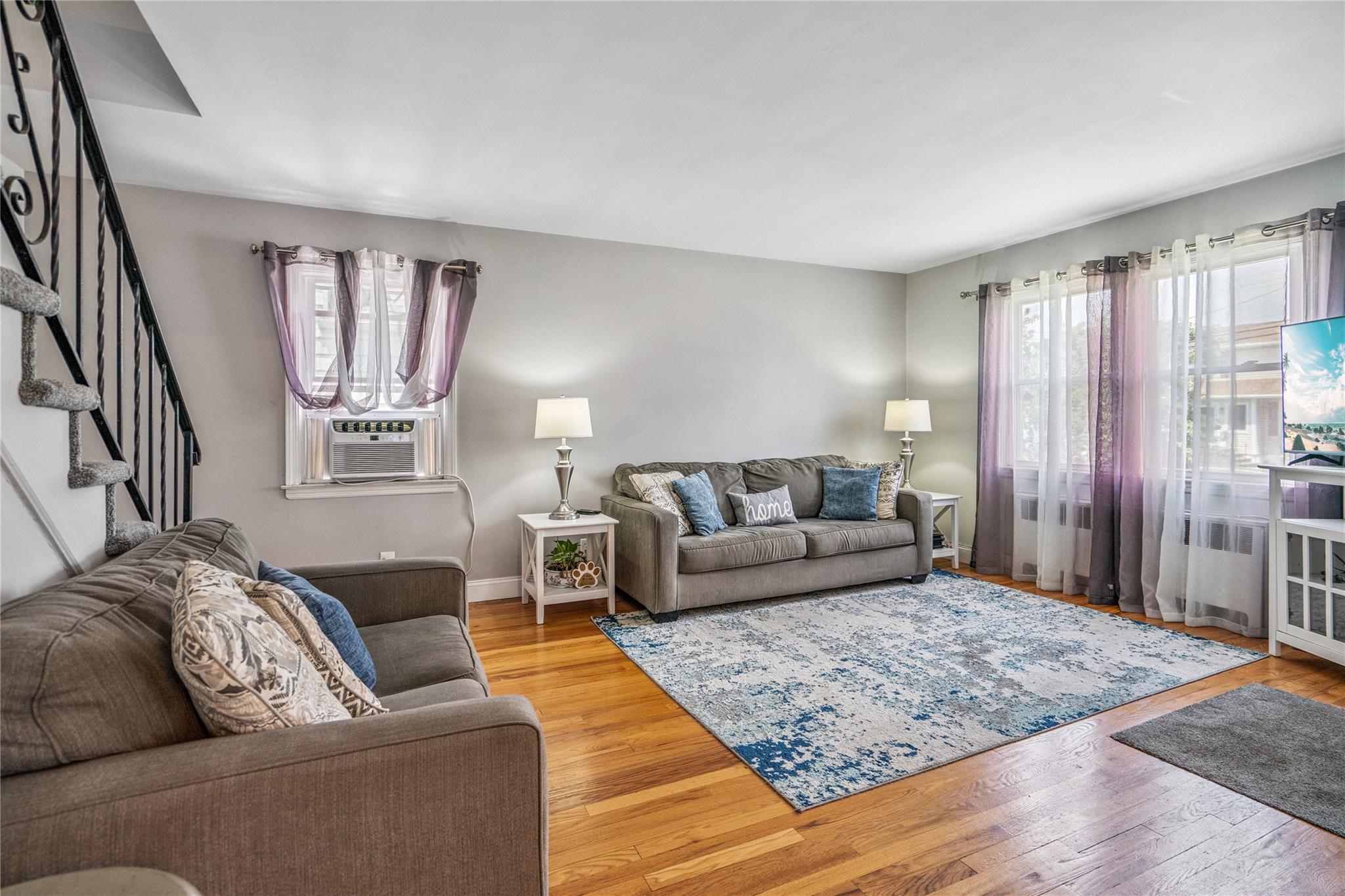12 Westmoreland Road Merrick, NY 11566 - Photo 18 of 42 a living room with furniture and a rug