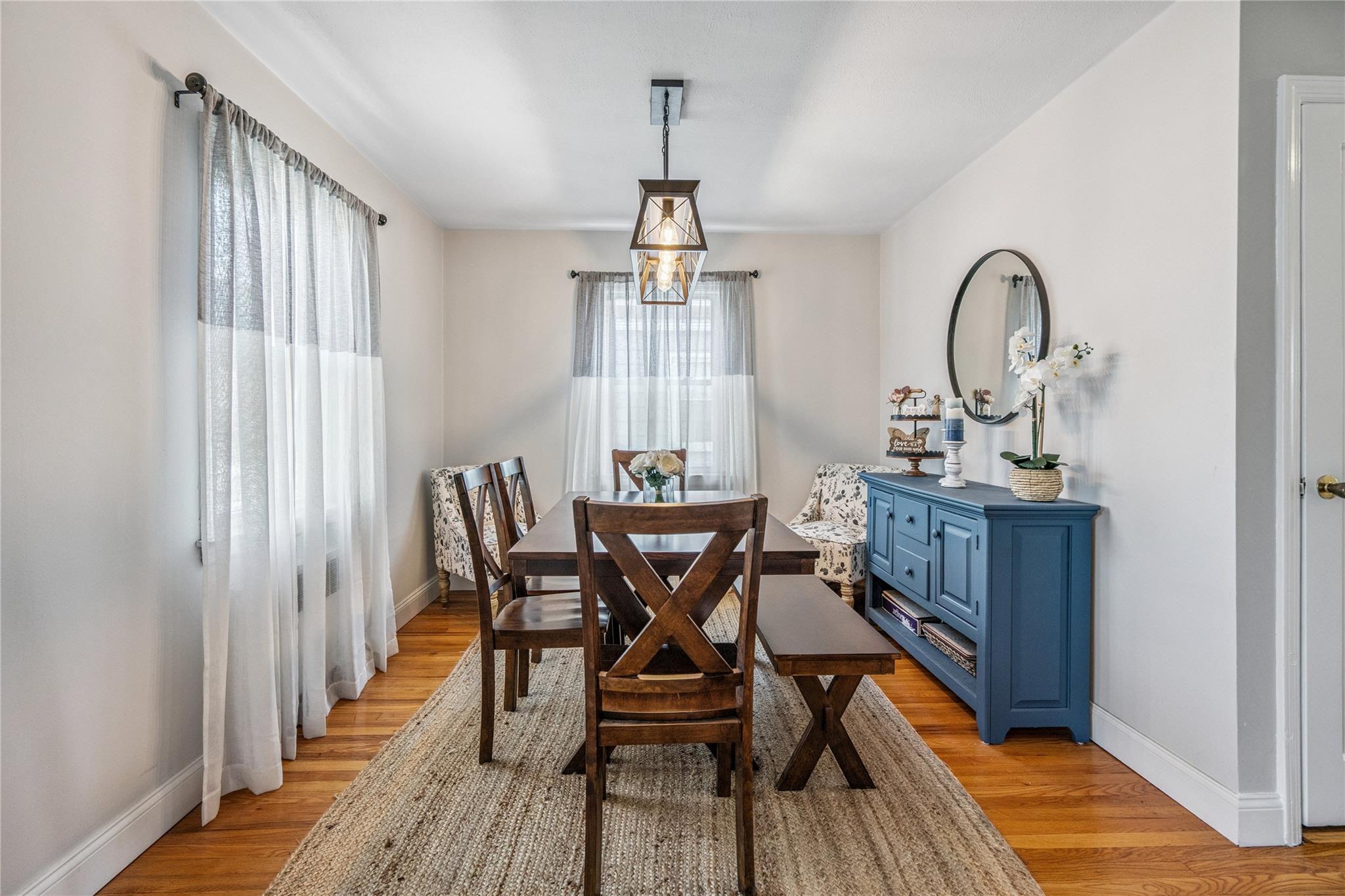 12 Westmoreland Road Merrick, NY 11566 - Photo 19 of 42 a view of a dining room with furniture window and wooden floor