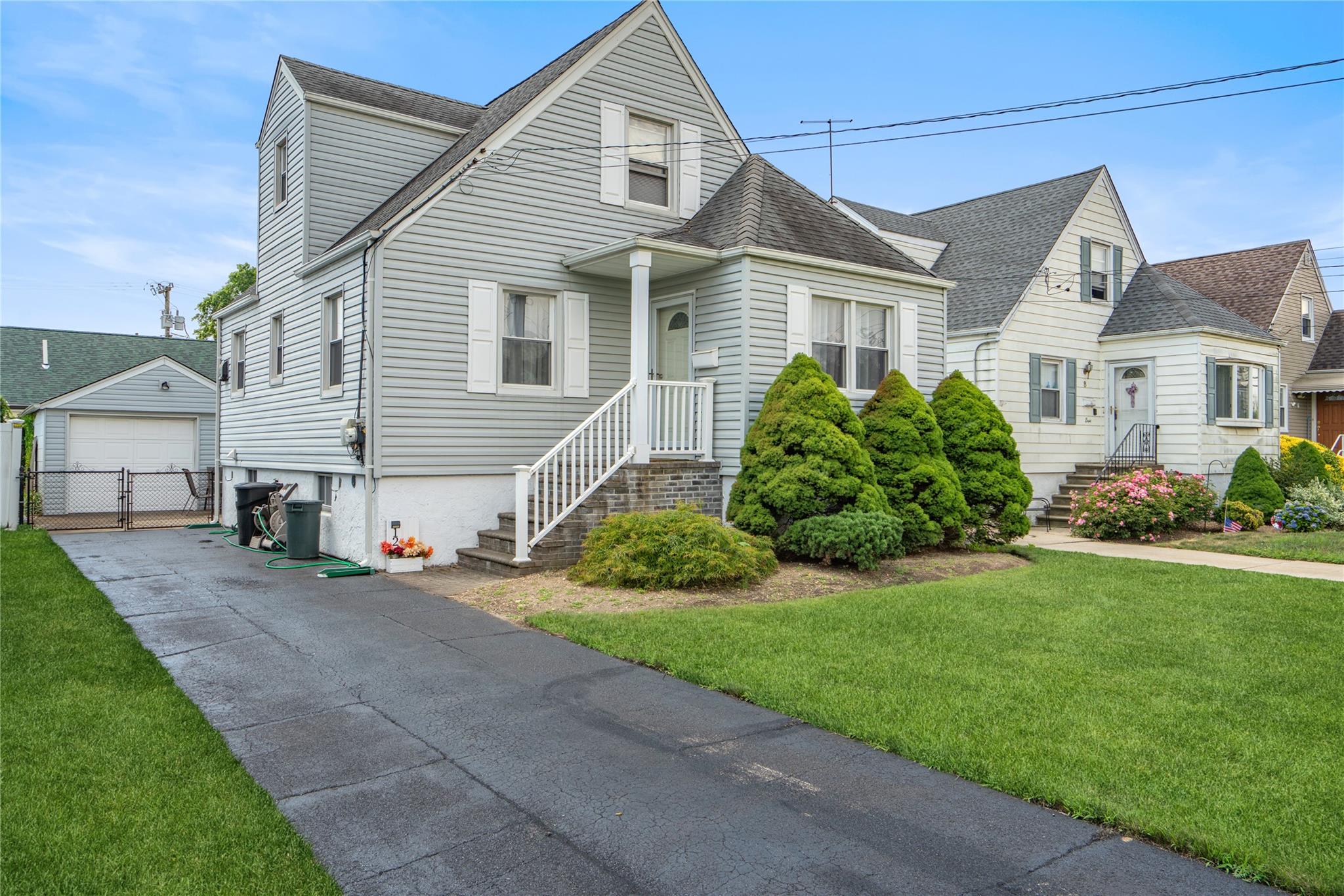12 Westmoreland Road Merrick, NY 11566 - Photo 2 of 42 a view of a yard in front of a house