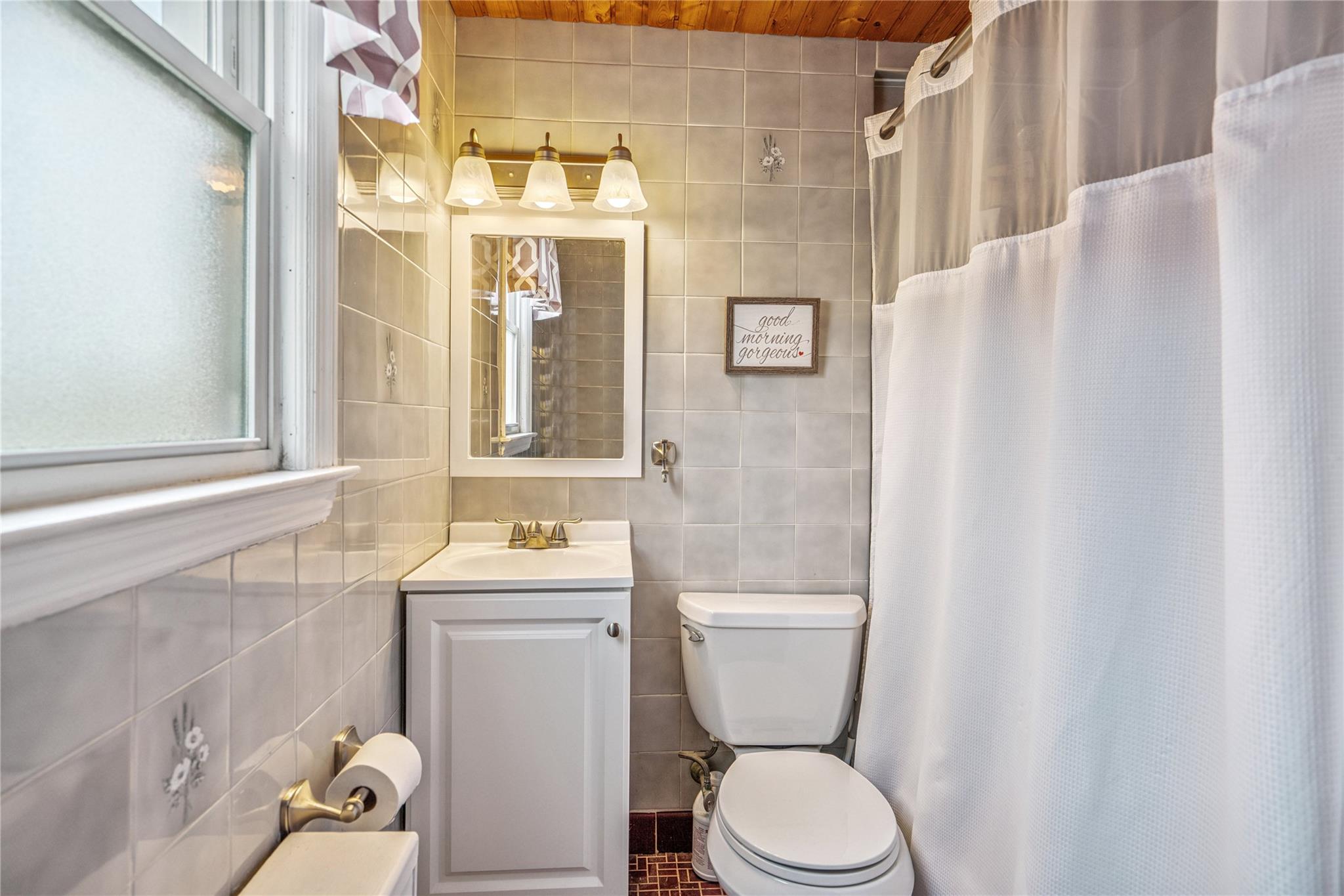 12 Westmoreland Road Merrick, NY 11566 - Photo 21 of 42 a bathroom with a sink toilet and shower