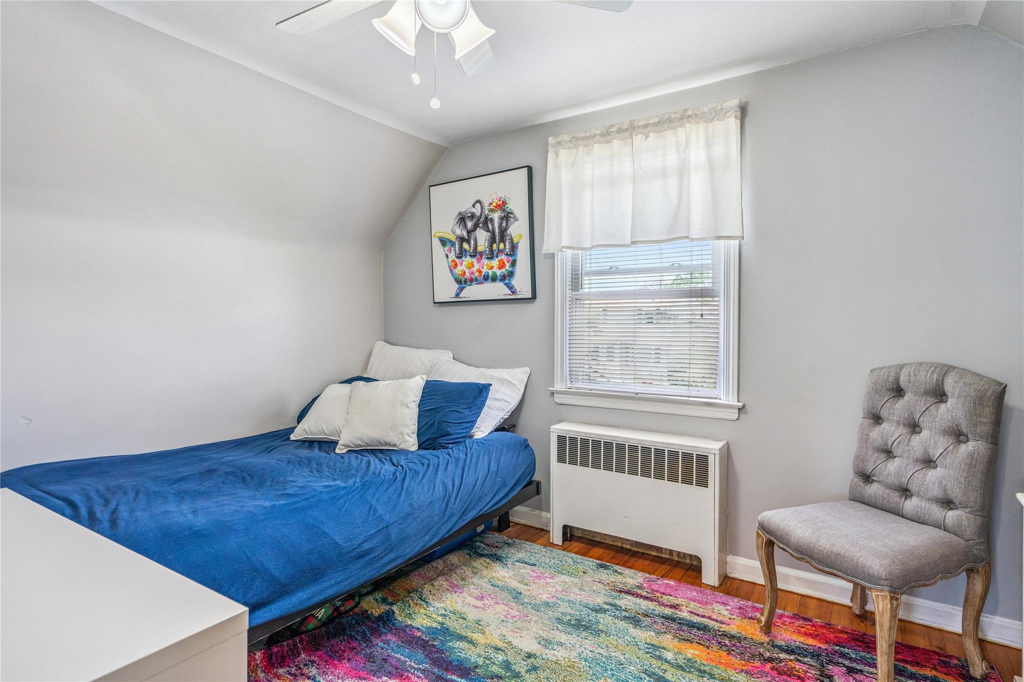 12 Westmoreland Road Merrick, NY 11566 - Photo 22 of 42 a bedroom with furniture and a window