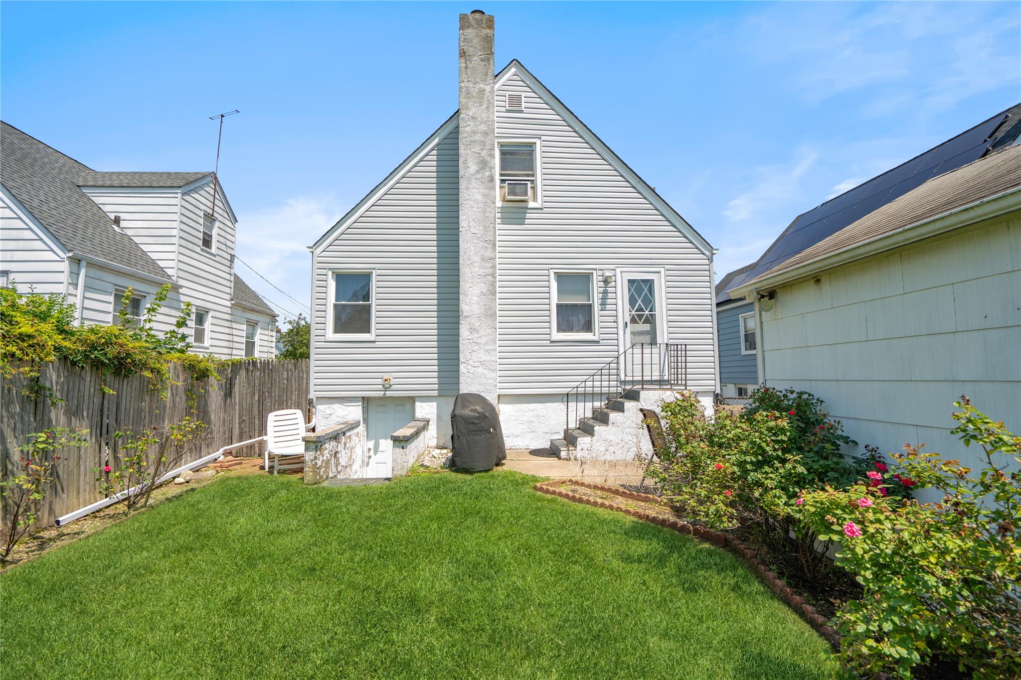 12 Westmoreland Road Merrick, NY 11566 - Photo 7 of 42 a front view of house with yard and outdoor seating