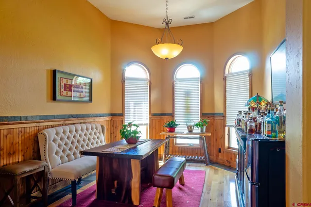 a bedroom with a large bed and a couch