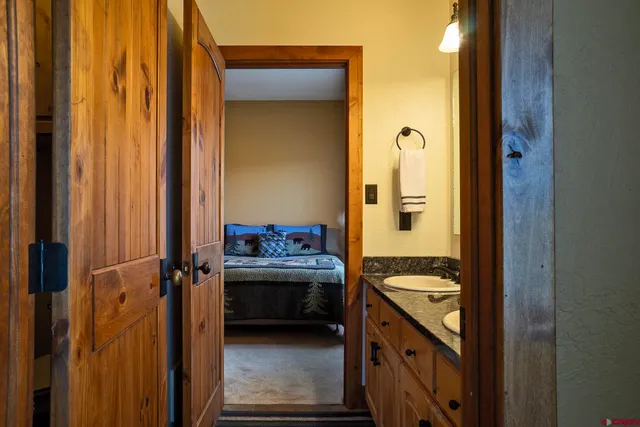 a view of a hallway with wooden floor and glass door