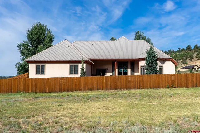 a view of a town with mountains in the background