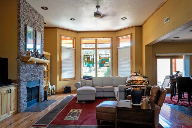 a living room with furniture and a large window