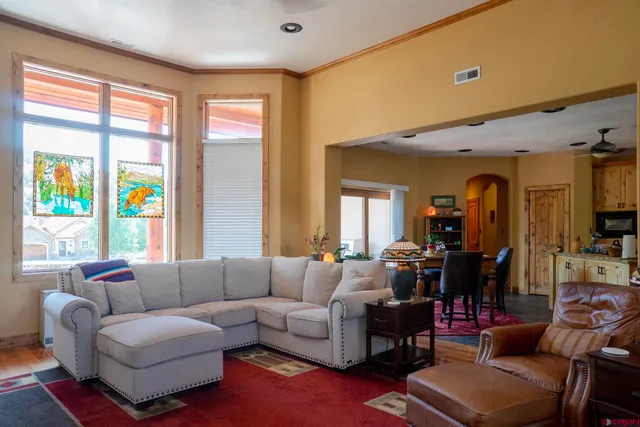 a room with furniture a rug and a window