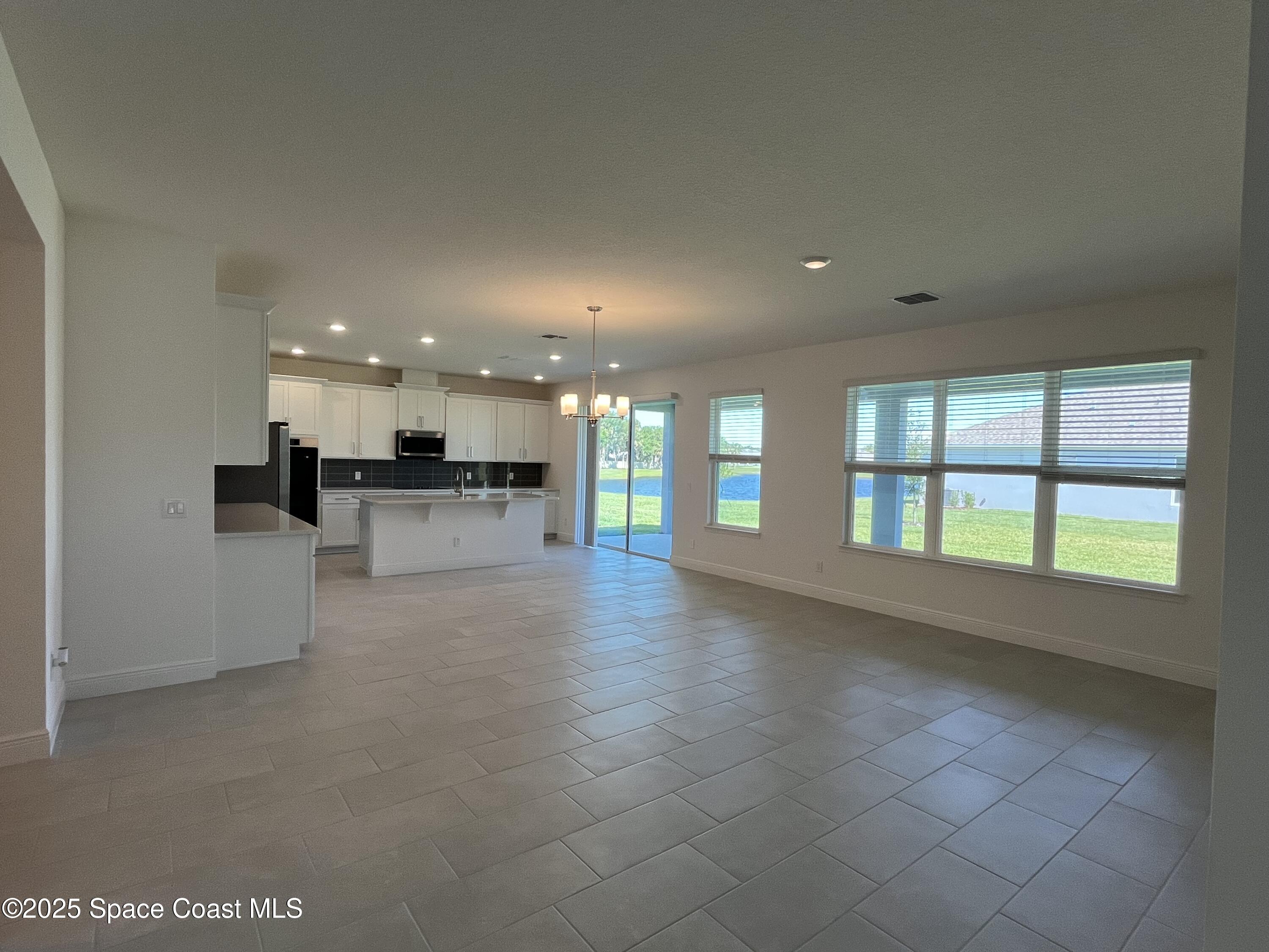 1163 Killian Drive Palm Bay, FL 32905 - Photo 5 of 14 Great Room / Dining / Kitchen