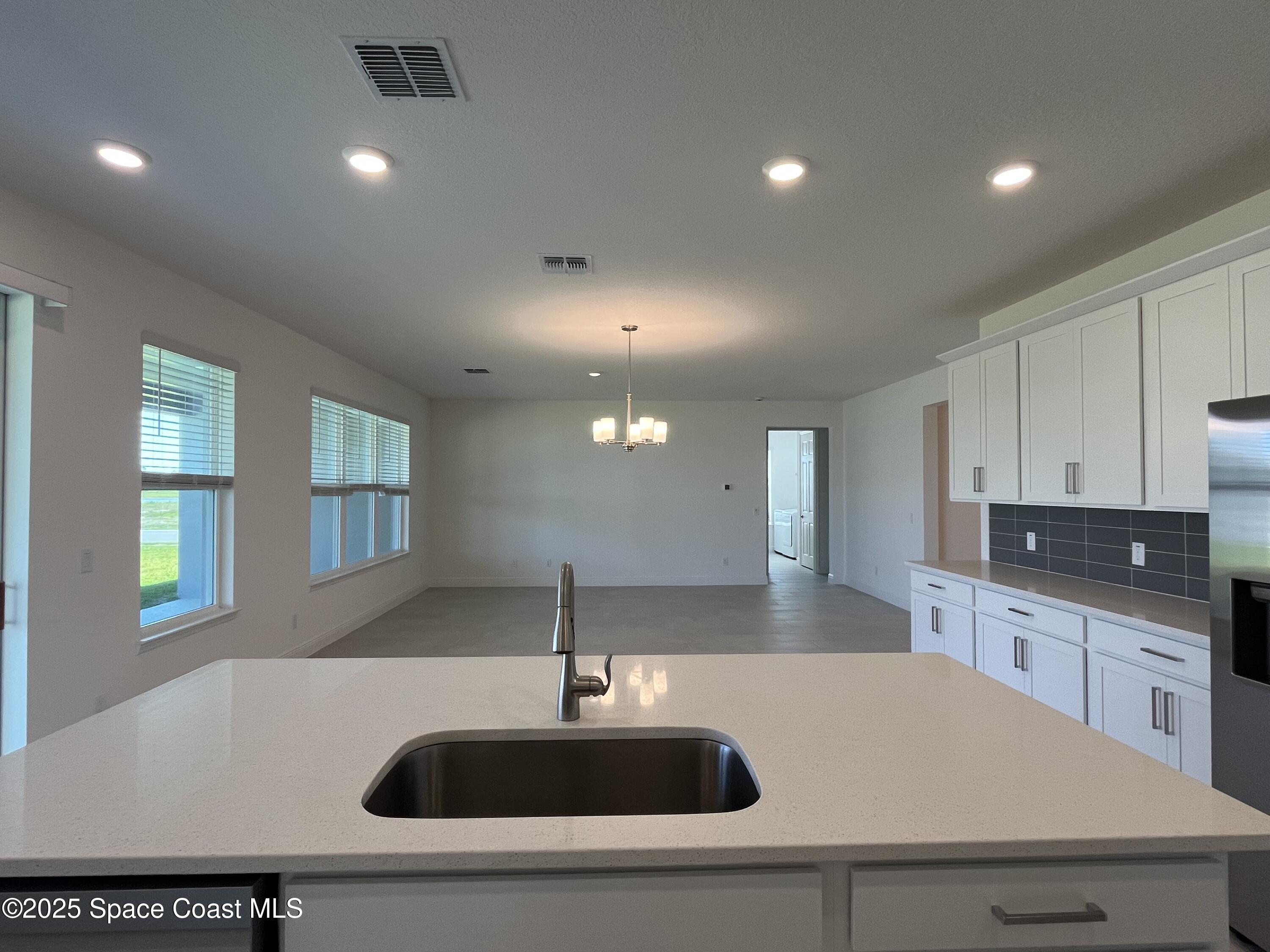 1163 Killian Drive Palm Bay, FL 32905 - Photo 6 of 14 Dining Area / Great Room