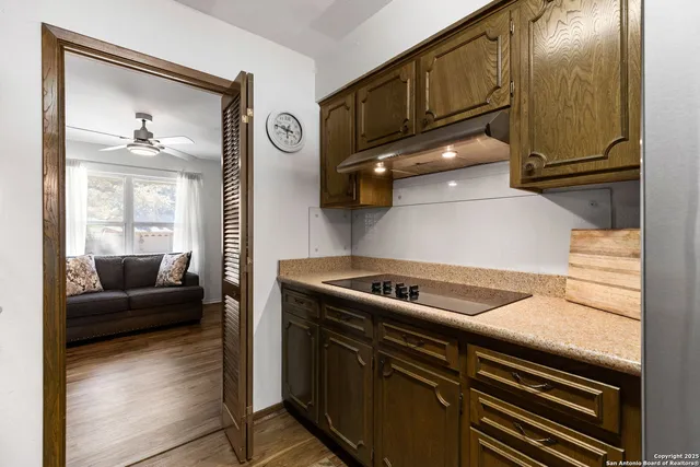 a kitchen with a stove and a microwave
